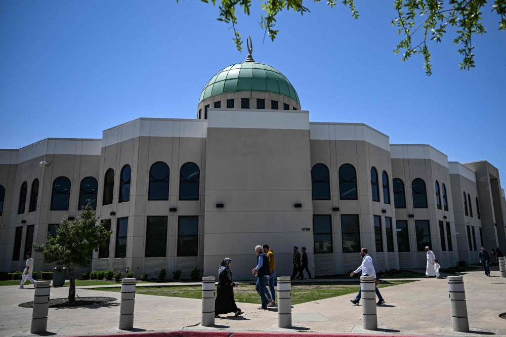 People arrive at a mosque to attend Friday prayers, in Plano, Texas, on April 11, 2025. — AFP pic