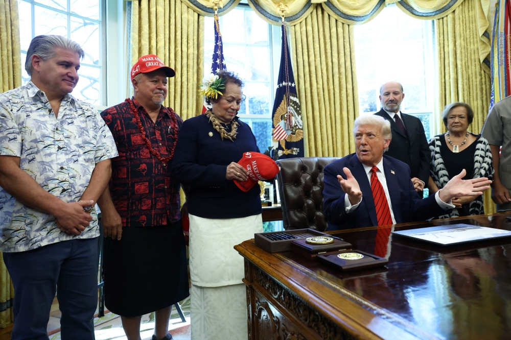US President Donald Trump gestures on the day he signs executive orders in the Oval Office at the White House in Washington April 17, 2025. — Reuters pic