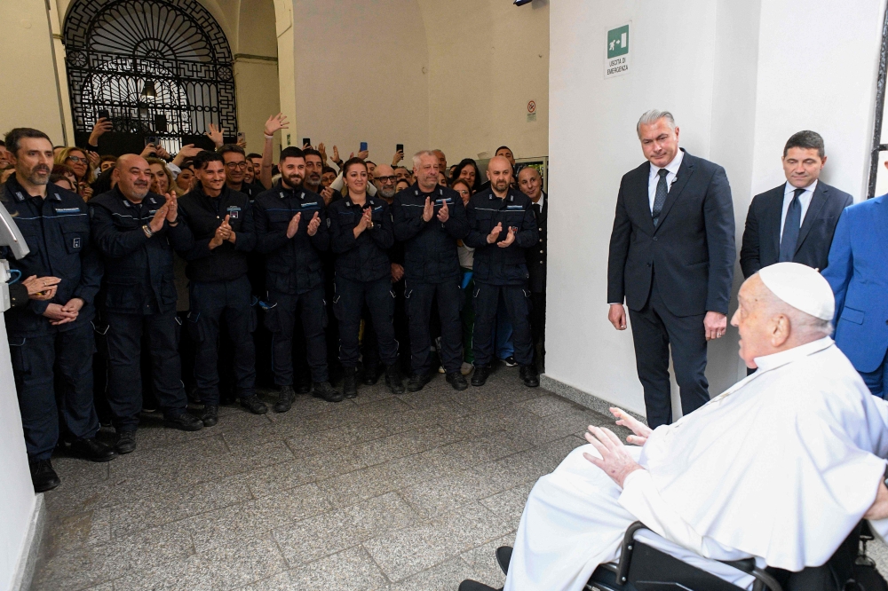 This photo taken and handout on April 17, 2025 by The Vatican Media shows Pope Francis  during a private visit at the ‘Regina Coeli’ prison where he met around 70 inmates as part of the Holy Thursday celebrations in Rome. — Vatican Media handout via AFP