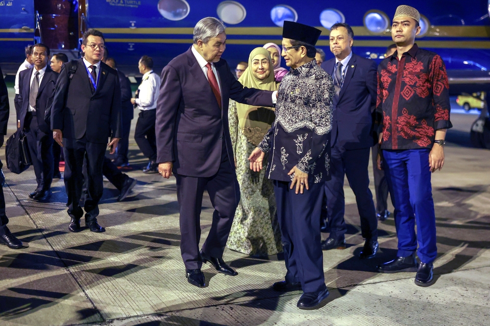 Deputy Prime Minister Datuk Seri Dr Ahmad Zahid Hamidi is welcomed by Indonesia’s Minister at the Ministry of Religious Affairs, Prof Nasaruddin Umar, upon his arrival at Soekarno-Hatta International Airport in Jakarta, on April 20, 2025. — Bernama pic