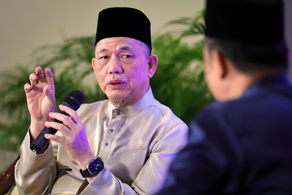Deputy Prime Minister Datuk Seri Fadillah Yusof speaks during a forum in Kampung Segedup, Kuching, on April 13, 2025. — Bernama pic