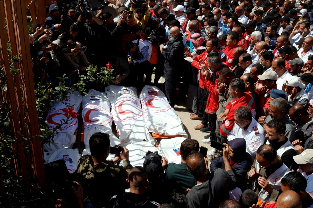 Palestinians mourn medics, who came under Israeli fire while on a rescue mission, after their bodies were recovered, according to the Red Crescent, at Nasser hospital in Khan Younis in the southern Gaza Strip March 31, 2025. — Reuters pic 