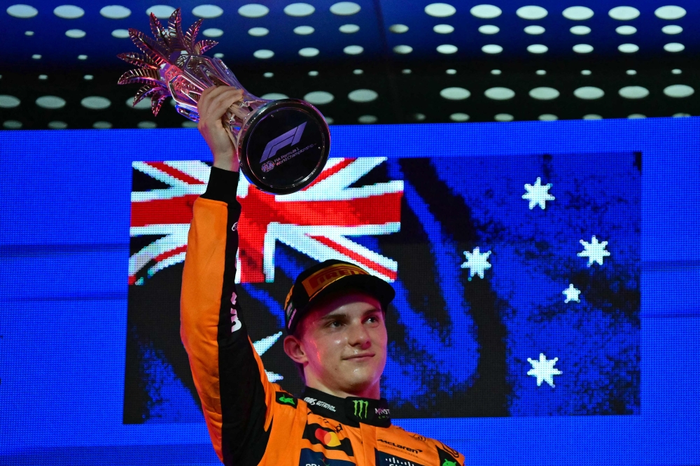 McLaren's Australian driver Oscar Piastri celebrates on the podium after winning the 2025 Saudi Arabia Formula One Grand Prix at the Jeddah Corniche Circuit April 20, 2025. — AFP pic
