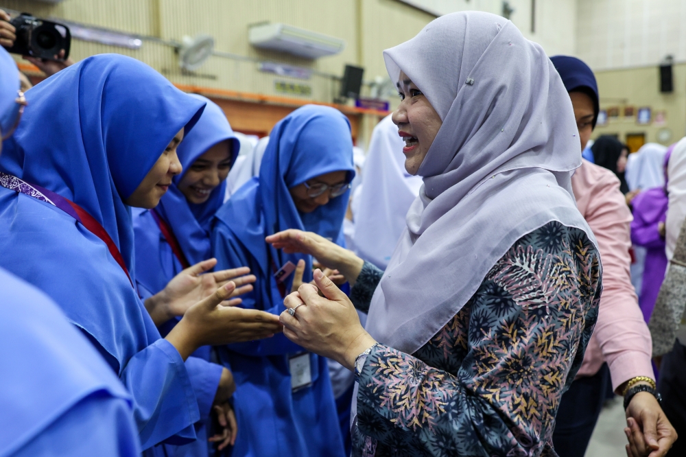 Education Minister Fadhlina Sidek engages with students at Sekolah Menengah Kebangsaan Datuk Haji Ahmad Badawi in Kepala Batas, Penang, on April 21, 2025. — Bernama pic