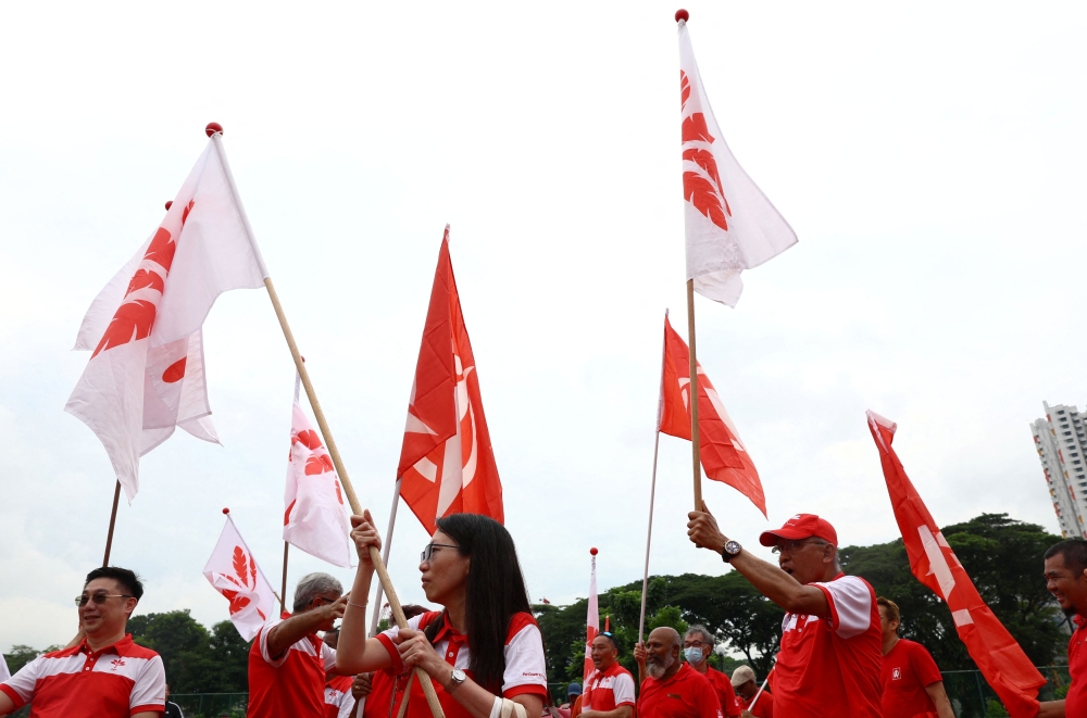 Supporters of Progressive Singapore Party and Singapore Democratic Party cheer for their candidates at a nomination centre ahead of the general election in Singapore April 23, 2025. — Reuters pic