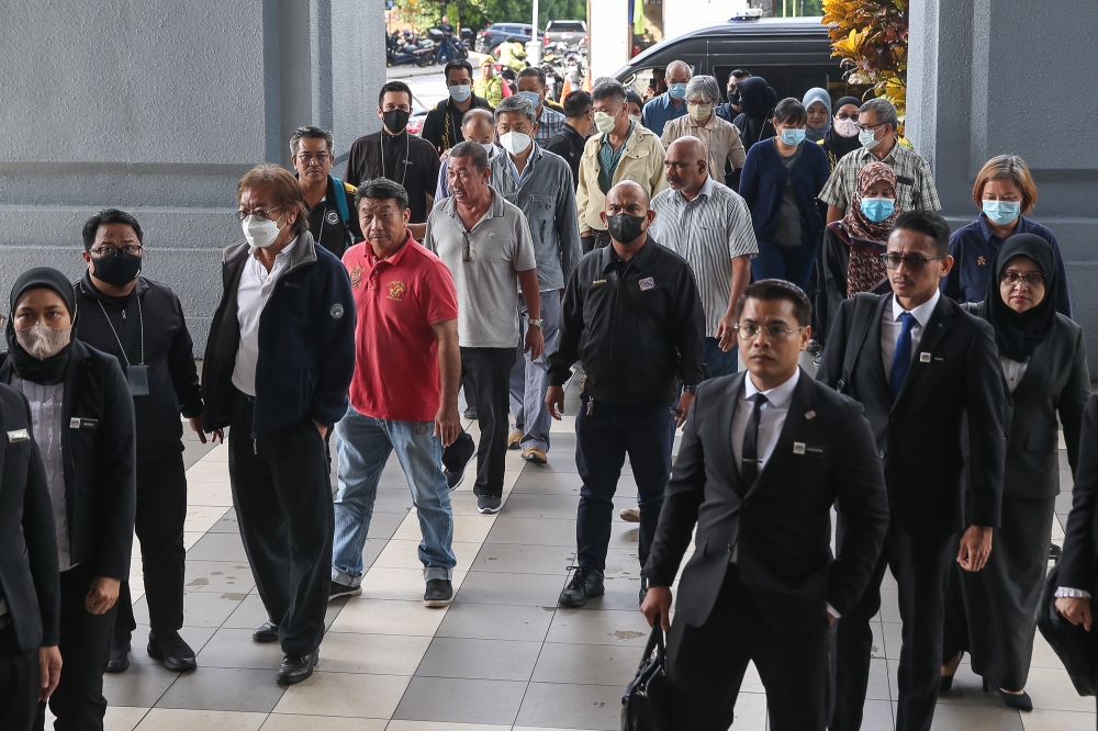 Fifteen people are among those who pleaded guilty to submitting false birth registration details for the purpose of obtaining legitimate birth certificates are pictured arriving at Kuala Lumpur Court Complex in Kuala Lumpur April 23, 2025. — Picture by Yusof Mat Isa