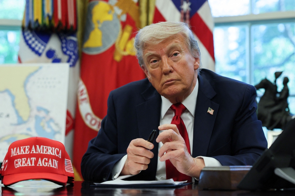 US President Donald Trump looks on at the White House in Washington, DC, US, April 23, 2025. — Reuters pic