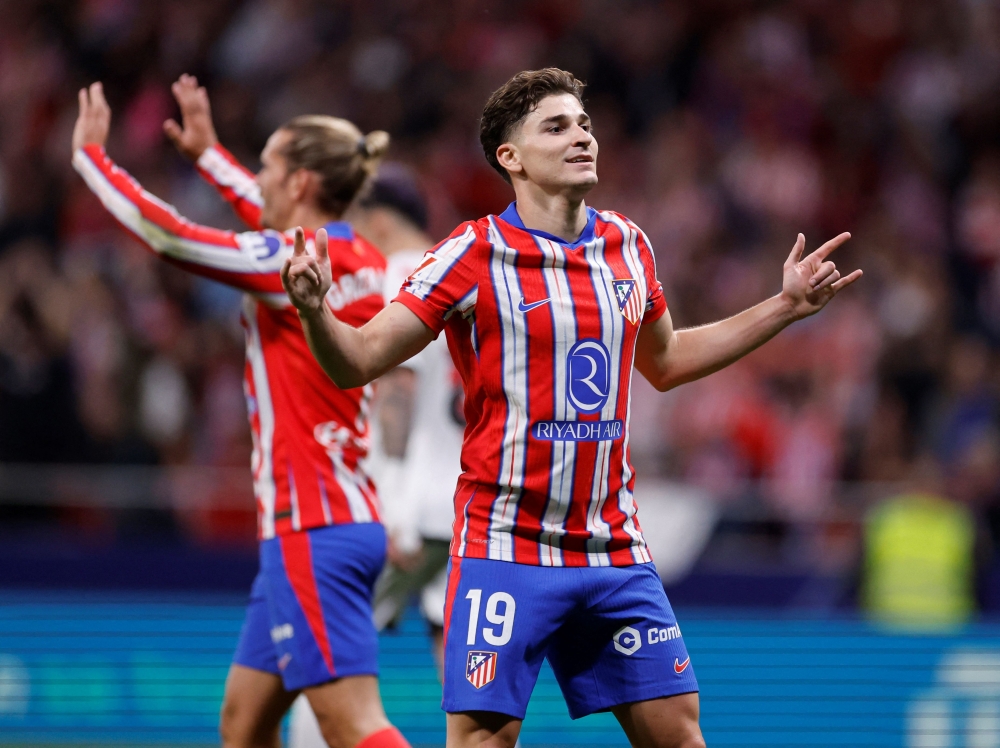 Atletico Madrid's Argentine forward Julian Alvarez celebrates scoring his team's third goal during the Spanish league football match between Club Atletico de Madrid and Rayo Vallecano de Madrid at the Metropolitano Stadium in Madrid. — AFP pic