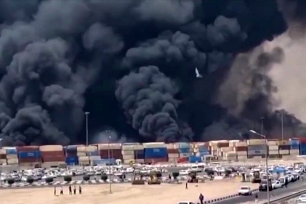 This image grab taken from footage released by the state television Islamic Republic of Iran Broadcasting News (Iribnews) on April 26, 2025 shows thick black smoke billowing following an explosion at the Shahid Rajaee port dock south-west of Bandar Abbas in the Iranian province of Hormozgan. — Iribnews/AFP pic