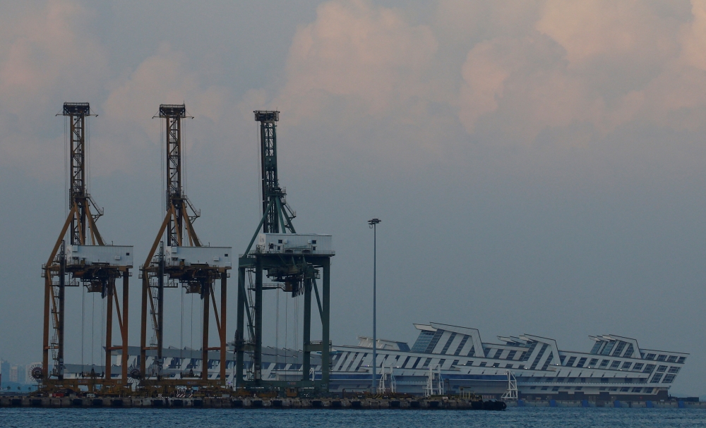 Container cranes are pictured at the Port of Singapore June 10, 2018. The United States is not prepared to lower its 10 per cent tariff on imports from Singapore, but both countries have agreed to explore ways to deepen their economic ties. — Reuters pic 
