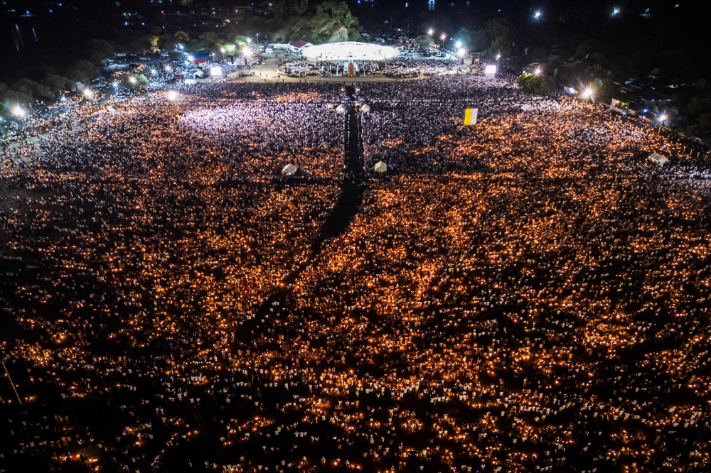 An aerial image shows Catholic believers holding candles during Pope Francis? requiem mass at the Esplanade of Tasitolu in Dili, East Timor, where he held a Mass in September last year, on April 26, 2025, as his funeral takes place in Vatican. The funeral for Pope Francis was held yesterday after the 88-year-old reformer died of a stroke on April 21, the Vatican announced. — AFP pic