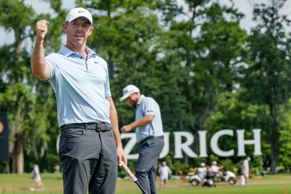Rory McIlroy reacts to an eagle putt on the 18th hole as his teammate Shane Lowry pumps his fist during the third round of the Zurich Classic of New Orleans golf tournament at Avondale, Louisiana April 26, 2025. — Matthew Hinton-Imagn Images pic via Reuters