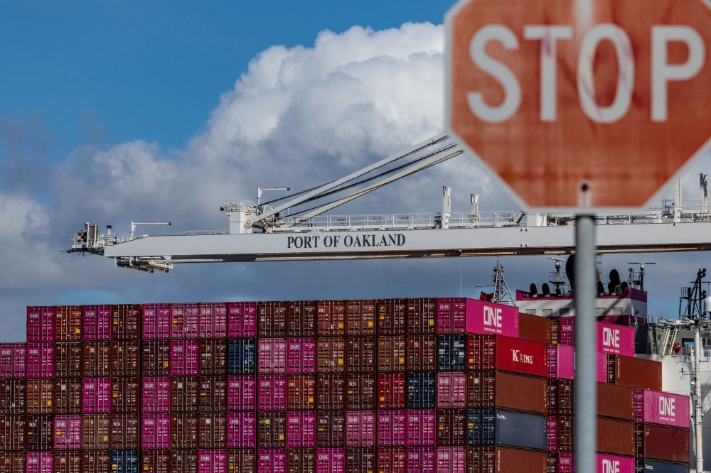 A cargo ship full of shipping containers is seen at the port of Oakland as trade tensions escalate over US tariffs, in Oakland, California March 6, 2025. — Reuters pic