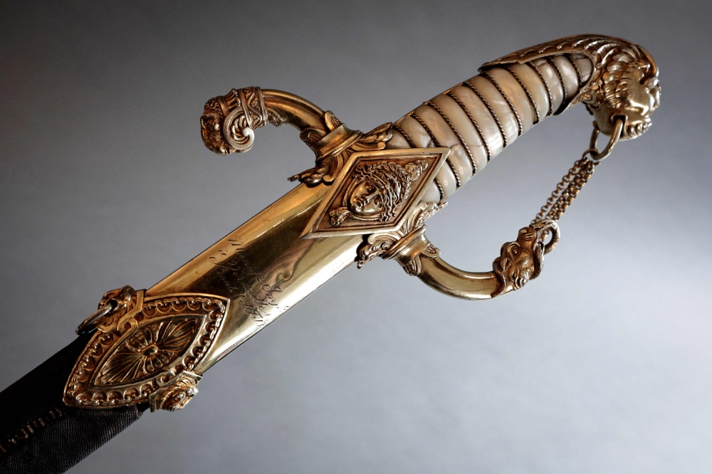 This photograph taken in Paris on April 25, 2025 shows details of the last sword that belonged to French Emperor Napoleon before its auction on May 22 at Hotel Drouot. Napoleon kept it until the end of his reign, before giving it to Emmanuel de Grouchy, the last Marshal of the Empire. Kept since 1815 by the marshal's descendants, it will be auctioned for the first time on May 22 at Hotel Drouot. — AFP pic