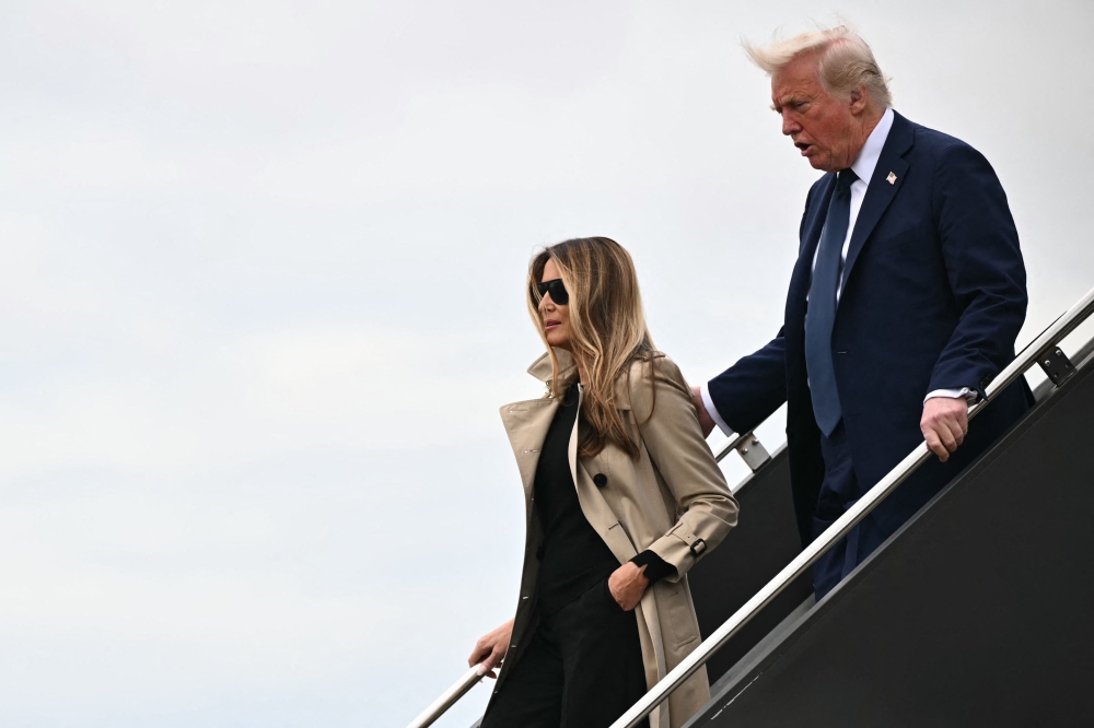 US President Donald Trump said he has been too busy to buy First Lady Melania a present for her 55th birthday yesterday, so he is treating her to a romantic dinner on Air Force One instead. — AFP pic