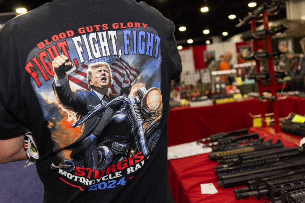 A person wears a T-shirt featuring an image of US President Donald Trump during the 2025 NRA Annual Meetings & Exhibits at the Georgia World Congress Centre in Atlanta, Georgia, April 26, 2025. — AFP pic