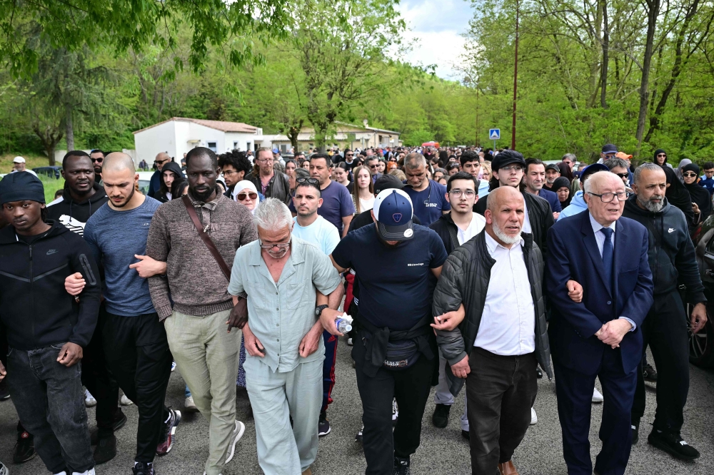 People attend a white march in memory of Aboubakar Cisse, the worshipper killed in a mosque by dozens of stab wounds on April 25, 2025, between the Khadidja mosque and the town hall of La Grand-Combe, southern France, on April 27, 2025. — AFP pic 