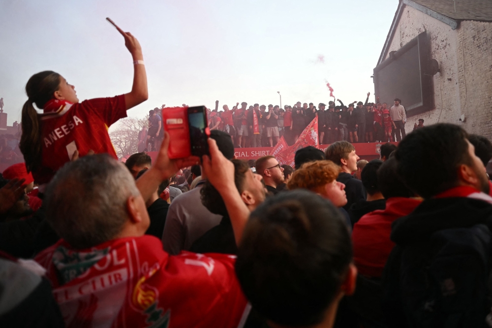 Liverpool fans celebrate in the street outside Anfield after the English Premier League football match between Liverpool and Tottenham Hotspur, in Liverpool, on April 27, 2025. — AFP pic 