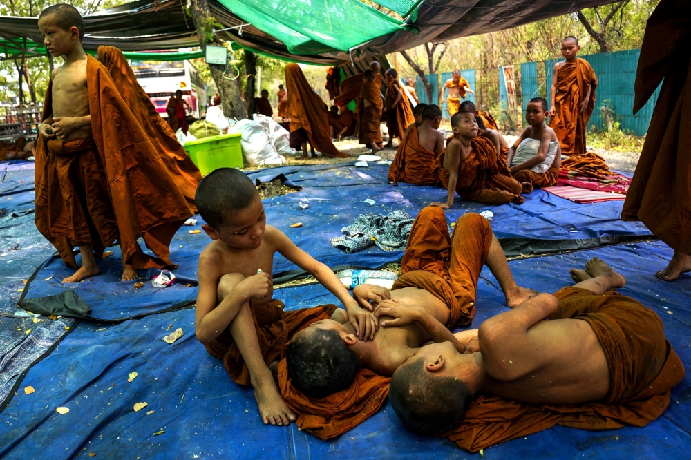 Novice monks are seen inside a shelter in a makeshift tent camp following a strong earthquake in Mandalay, Myanmar, April 3, 2025. Malaysia and Vietnam unanimously agreed to continue humanitarian assistance to all Myanmar citizens without restrictions to ensure the well-being of the people in the country. — Reuters/Stringer pic 