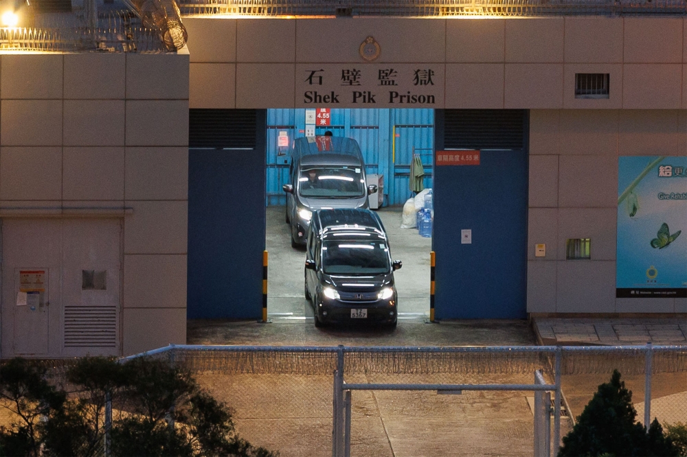 A car with curtains drawn, one of two, is seen leaving Hong Kong’s Shek Pik prison just before sunrise on April 29, 2025. Police at the scene confirmed that pro-democracy activist and former Hong Kong opposition lawmaker Gary Fan, who was imprisoned under Hong Kong’s National Security Law, has left the prison, after finishing a prison sentence of four years and two months. — AFP pic