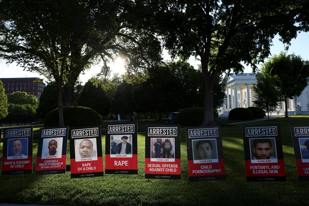 Posters of people described as arrested illegal immigrants are displayed outside the White House in Washington, April 28, 2025. In a sign of Trump’s focus on immigration, placards lined the White House lawn Monday displaying the mugshots of immigrants. The word ‘arrested’ was printed in capital letters above each photo and, below, the crime of which they were accused — from ‘first-degree murder’ and ‘sexual abuse of a child’ to ‘distribution of fentanyl.’ — Reuters pic 
