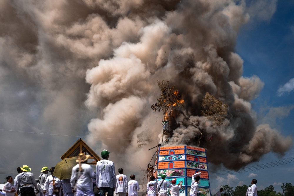 This photo taken on April 23, 2025 shows smoke rising from cremations during the Lang Pacha ceremony at the Dhamma of Buddha Nakhon Ratchasima Foundation complex in Thailand's Nakhon Ratchasima province. — AFP pic