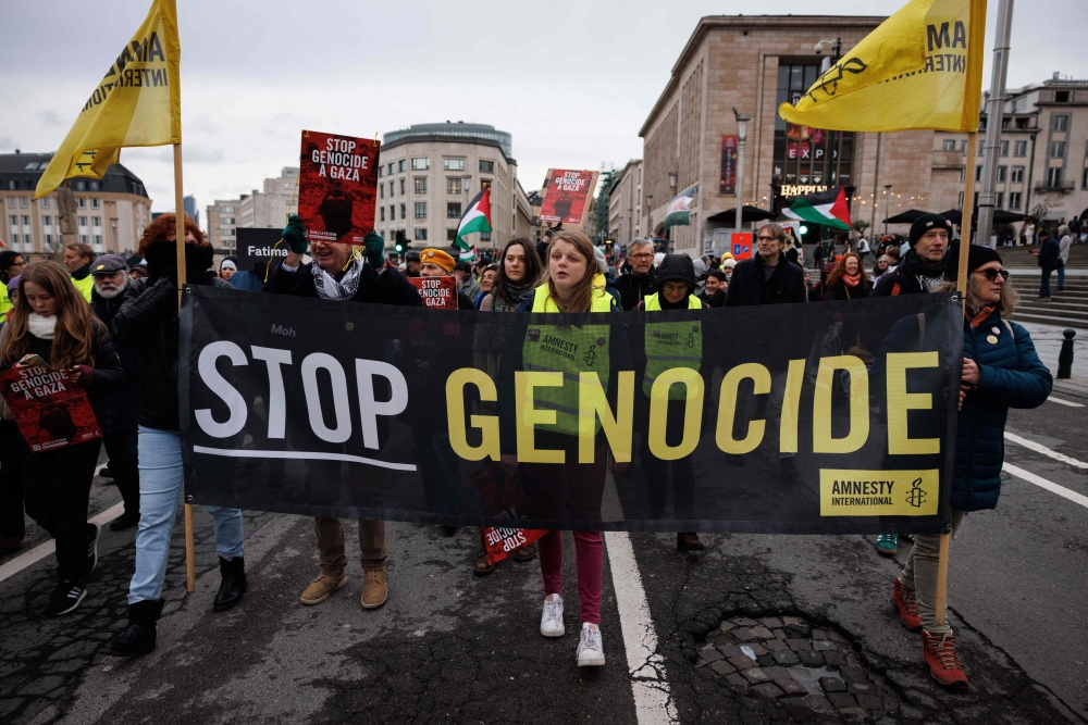 In its annual report, Amnesty said Israel was acting with 'specific intent to destroy Palestinians in Gaza, thus committing genocide'. — AFP pic