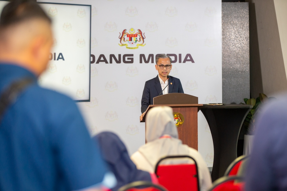 Communications Minister Fahmi Fadzil speaks during a press conference at the Communications Ministry in Putrajaya. March 30, 2025 — Picture by Raymond Manuel