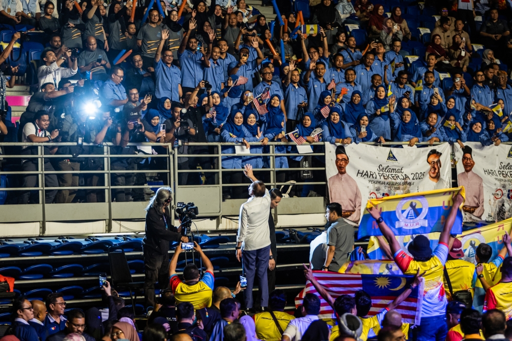 Prime Minister Datuk Seri Anwar Ibrahim greet workers at the 2025 Labour Day celebration at the Axiata Arena in Bukit Jalil, Kuala Lumpur on May 1, 2025. — Picture by Firdaus Latif
