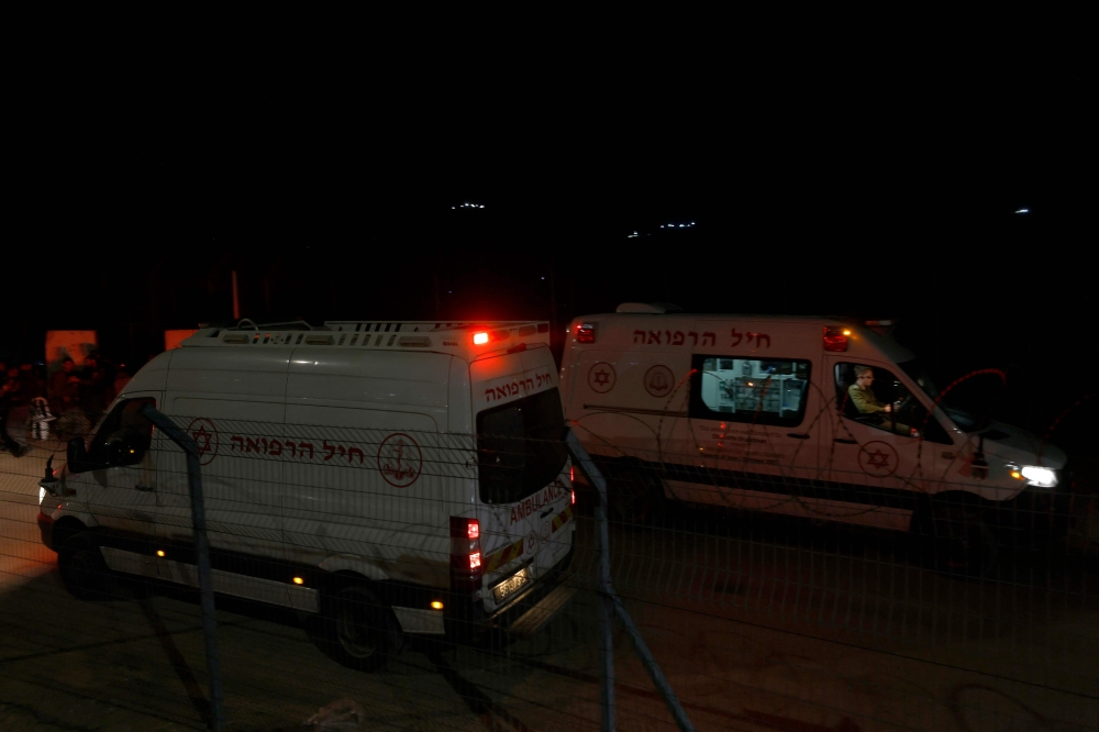 Israeli military ambulances transporting injured Syrian Druze to an Israeli hospital cross the border fence near the Druze village of Majdal Shams in the Israel-annexed Golan Heights on April 30, 2025. — AFP 