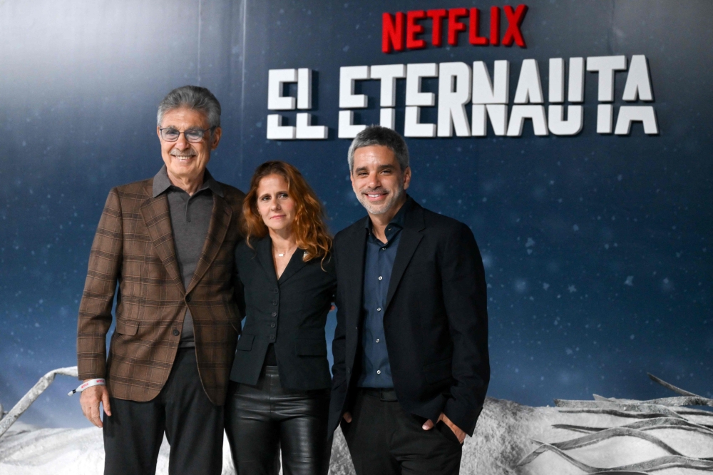 (From left) Argentine businessman Hugo Sigman and Argentine film producers Leticia Cristi and Matias Mosteirin pose during the premiere of the Netflix streaming series ‘El Eternauta’ (The Eternaut) in Buenos Aires April 29, 2025. — AFP pic