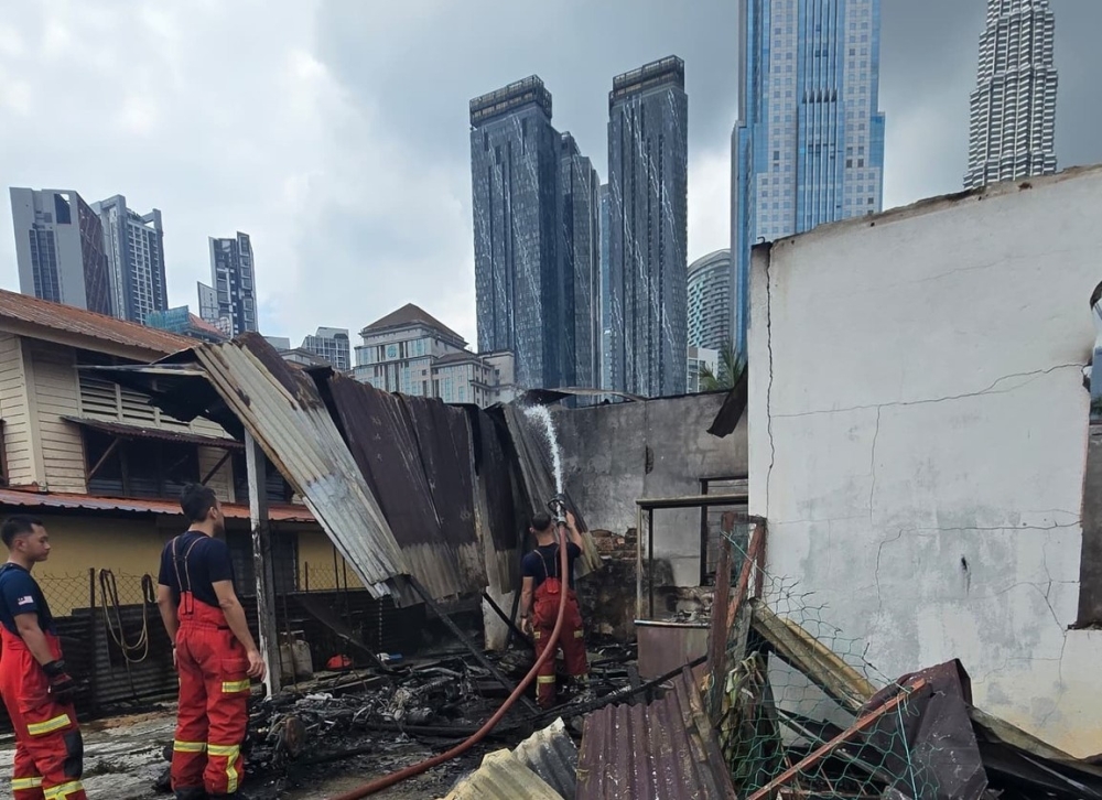 Three houses were destroyed by fire at Pintasan Raja Muda Musa 4, Kampung Baru, here this morning. — Picture via Facebook/Johari Abdul Ghani