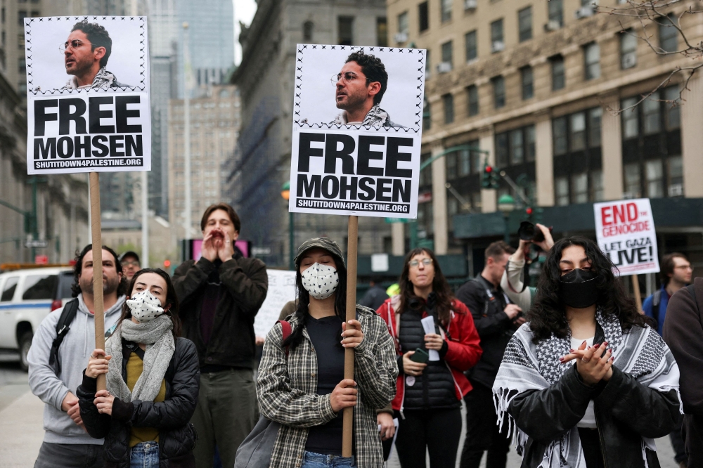 Demonstrators hold placards that read ‘Free Mohsen’ in reference to Mohsen Mahdawi, a Palestinian green card holder and student at Columbia University that was detained, as they gather at Foley Square calling for the release of Palestinian activist and Columbia University graduate student Mahmoud Khalil, in Manhattan, New York City, April 15, 2025. — Reuters pic 