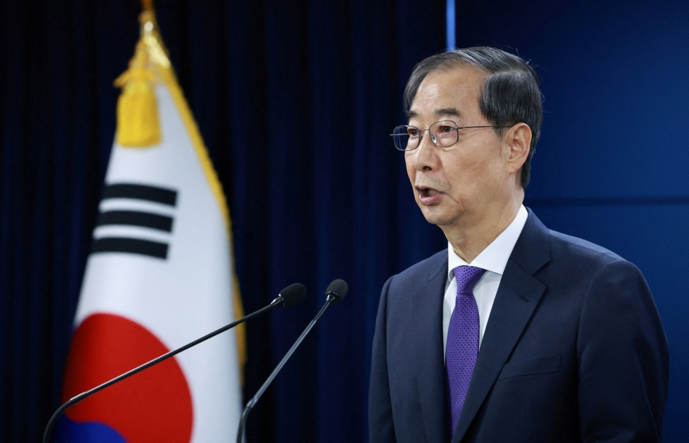 South Korea's acting President Han Duck-soo speaks during a press conference in Seoul May 1, 2025. — Yonhap/Reuters pic  
