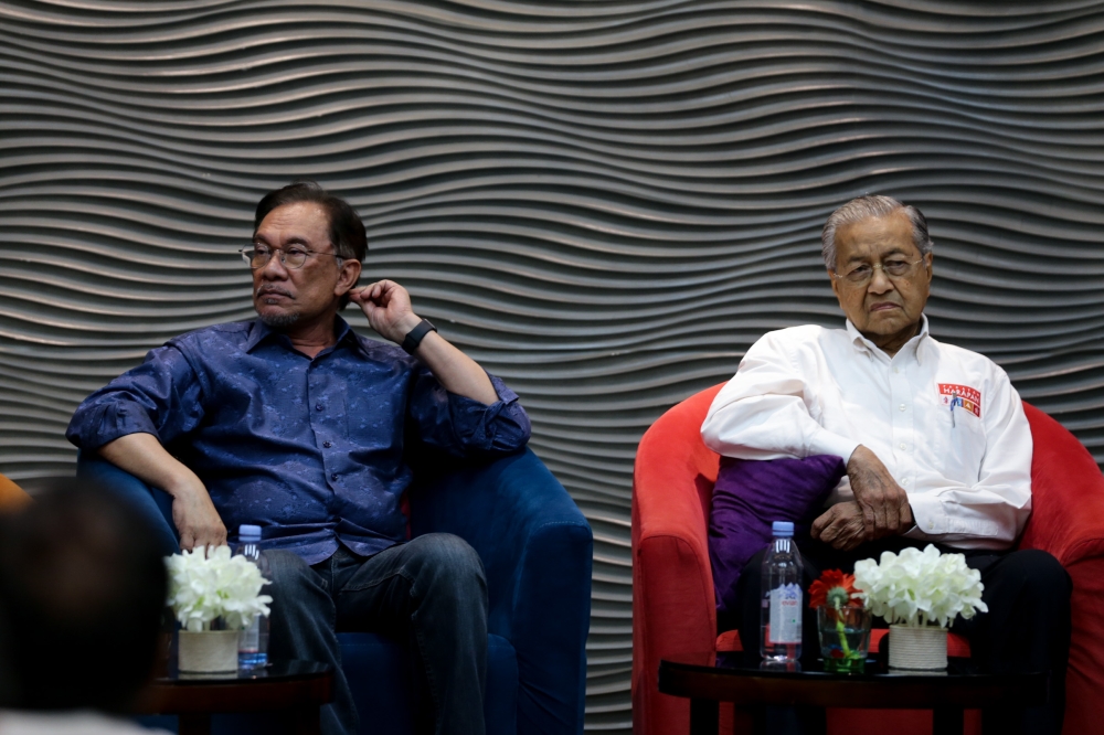 Tun Dr Mahathir Mohamad (right) and Datuk Seri Anwar Ibrahim during a PKR Retreat program in Port Dickson in July 19, 2019. — Picture by Ahmad Zamzahuri