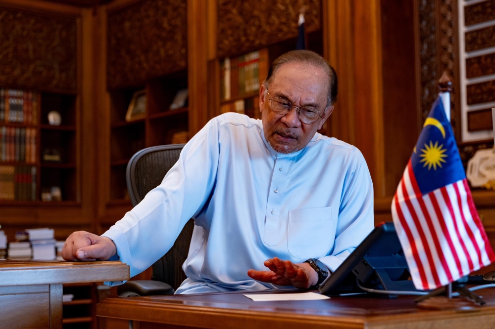 Datuk Seri Anwar Ibrahim doing the phone call with Philippine President Ferdinand Romualdez Marcos Jr. — Picture from Facebook/Anwar Ibrahim