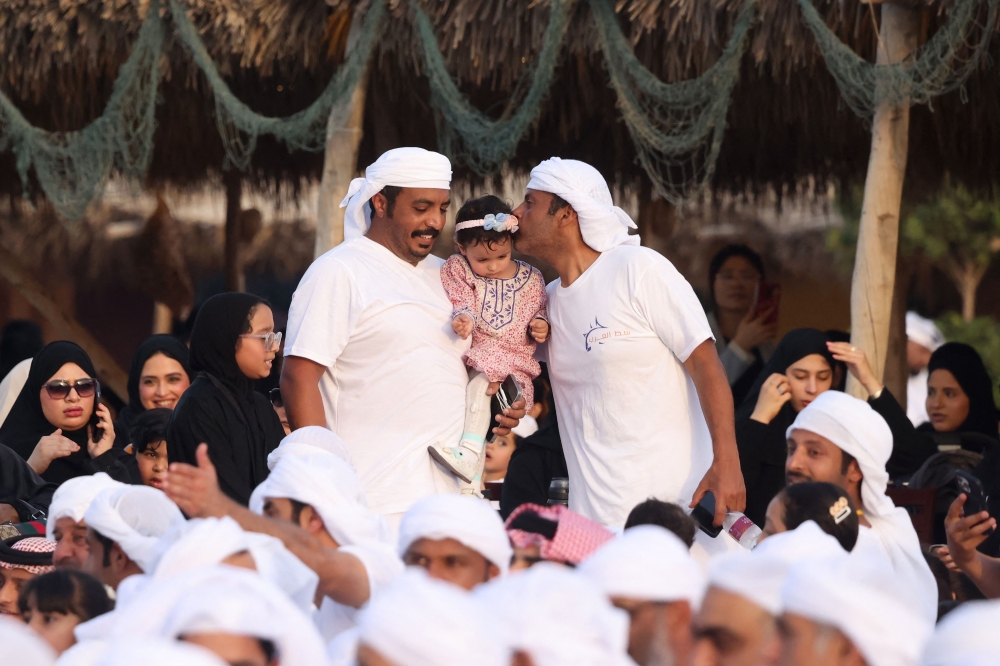 Men in customary sea gear – a white t-shirt and towel – reprise the age-old tradition of line-fishing in the energy-rich Gulf emirate for the 11th edition of the Senyar festival. — AFP pic