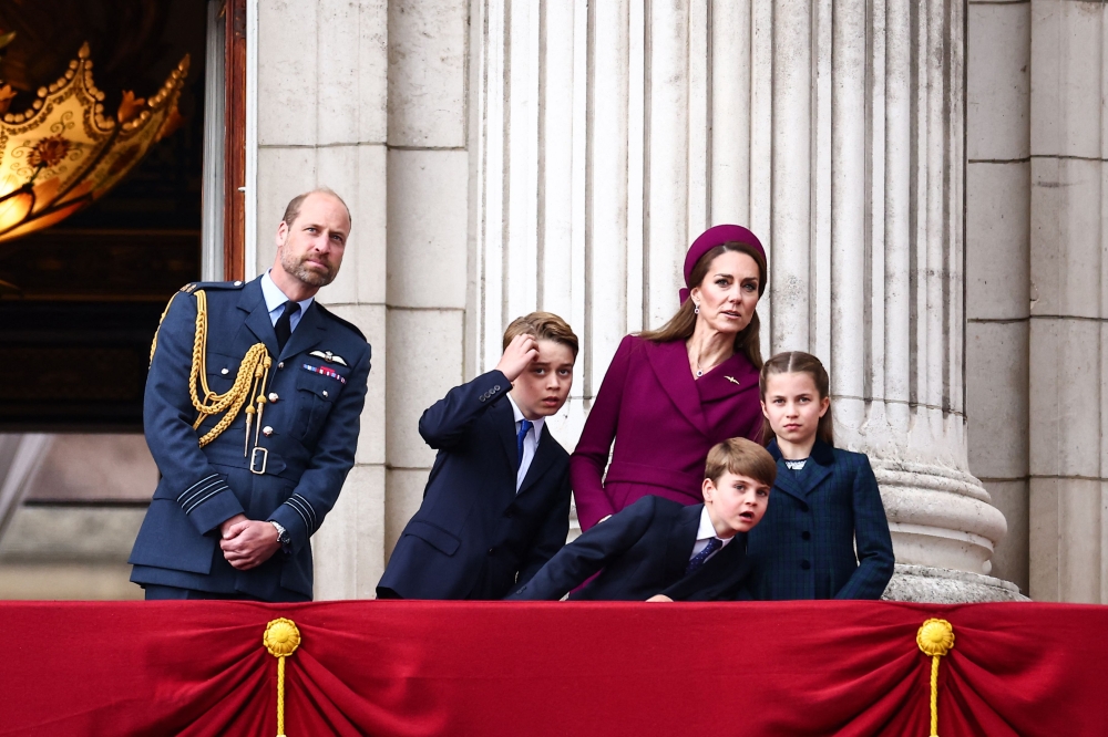 Britain's Prince William, Prince of Wales, Britain's Prince George of Wales, Britain's Prince Louis of Wales, Britain's Catherine, Princess of Wales and Britain's Princess Charlotte of Wales watch the flypast from Buckingham Palace balcony after attending the armed forces procession yesterday to celebrate the 80th anniversary of VE Day also known as Victory in Europe Day. — AFP pic