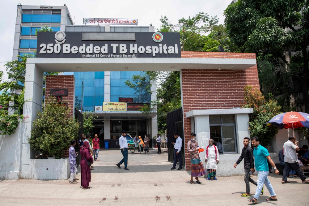 People walk past the 250 Bedded TB Hospital, formerly funded by the US development agency USAID in Dhaka, Bangladesh, on April 23, 2025. — AFP pic