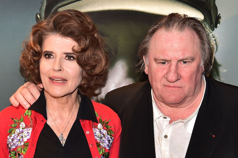 Actor Gerard Depardieu (right), who has been implicated in several cases of sexual violence, is filming in Portugal under the direction of his friend, French actress and director Fanny Ardant (left). — AFP pic