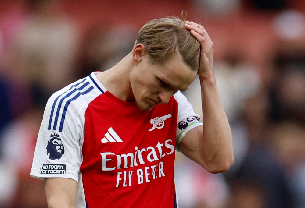 Arsenal's Martin Odegaard looks dejected after the match with AFC Bournemouth. — Reuters pic