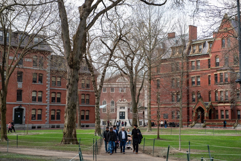 This file photo shows people walking through Harvard Yard on the Harvard University campus in Cambridge, Massachussetts April 15. — Reuters pic