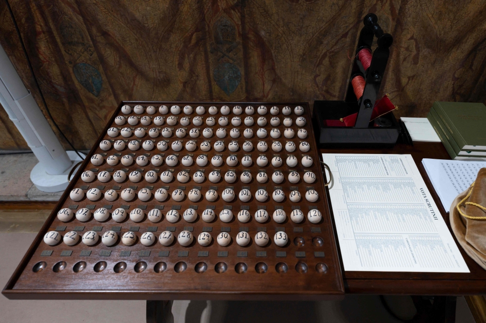 A handout photo shows 133 balls with numbers corresponding to each cardinal elector in the Sistine Chapel. — AFP pic/Vatican Media