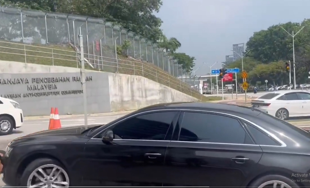 A car believed to be ferrying former prime minister Datuk Seri Ismail Sabri Yaakob is seen arriving at the MACC headquarters, May 7, 2025 in this screengrab.