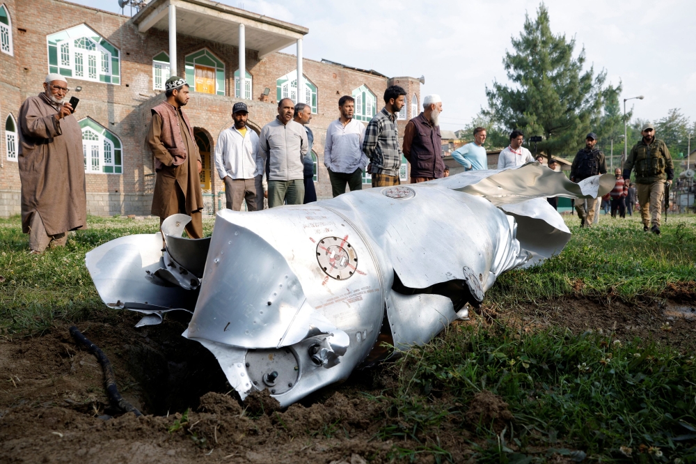 Metal debris lies on the ground in Wuyan in south Kashmir’s Pulwama district district May 7, 2025. — Reuters pic