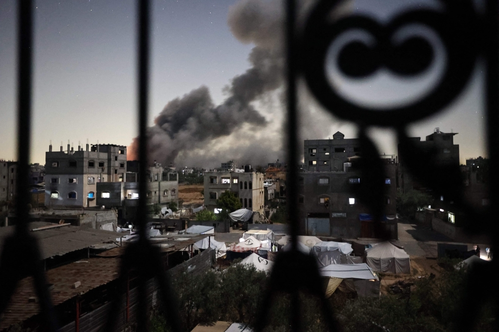 Smoke rises following an Israeli strike in the Bureij refugee camp in the centre of the Gaza Strip May 6, 2025. Senior Hamas official Bassem Naim told AFP today that the militant group insisted on a ‘comprehensive agreement’ to end the war with Israel in Gaza, now in its 19th month. — AFP pic