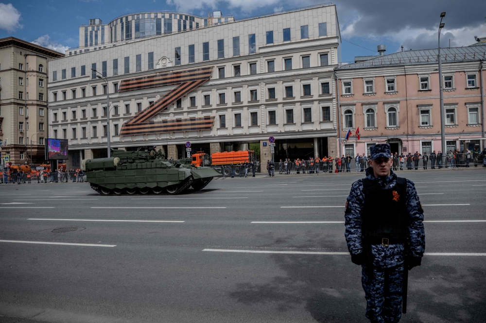 A Russian military vehicle moves along the Garden Ring road in front of a huge Z letter, a tactical insignia of Russian troops in Ukraine, prior to the general rehearsal of the Victory Day military parade, to be held at Red Square, in central Moscow yesterday. — AFP pic