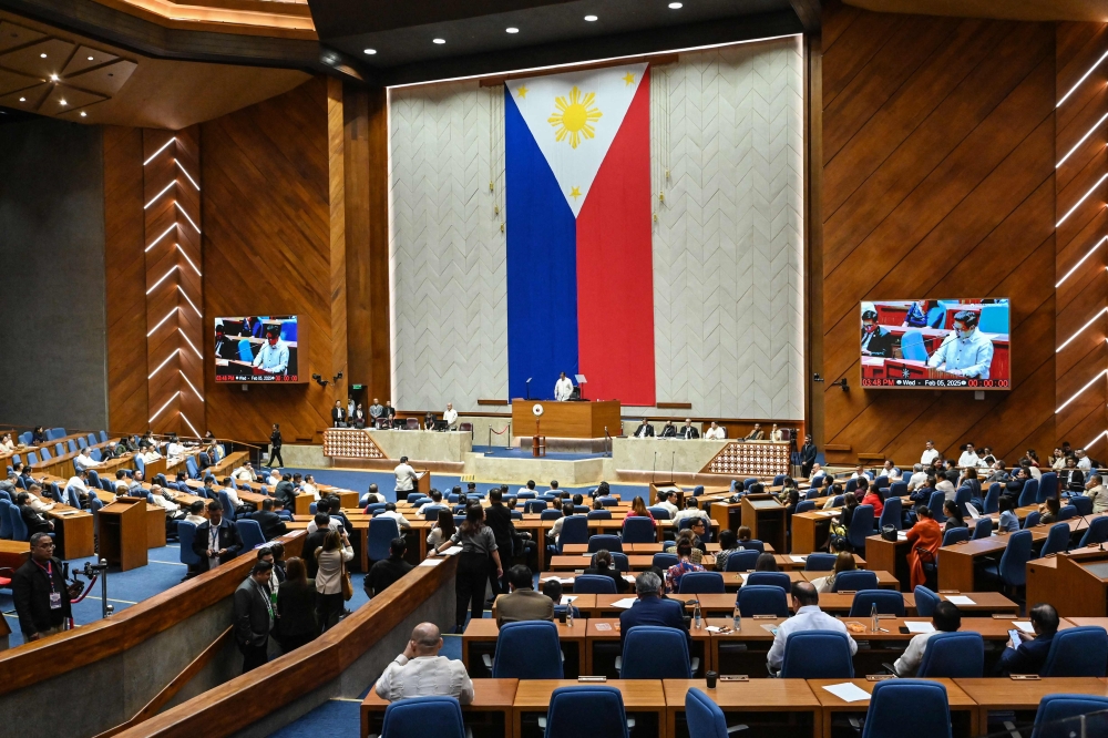 Speaker of the House Martin Romualdez (centre) presides over a session where lawmakers voted to impeach Vice President Sara Duterte at the House of Representatives in Quezon City, Metro Manila on February 5, 2025. — AFP pic