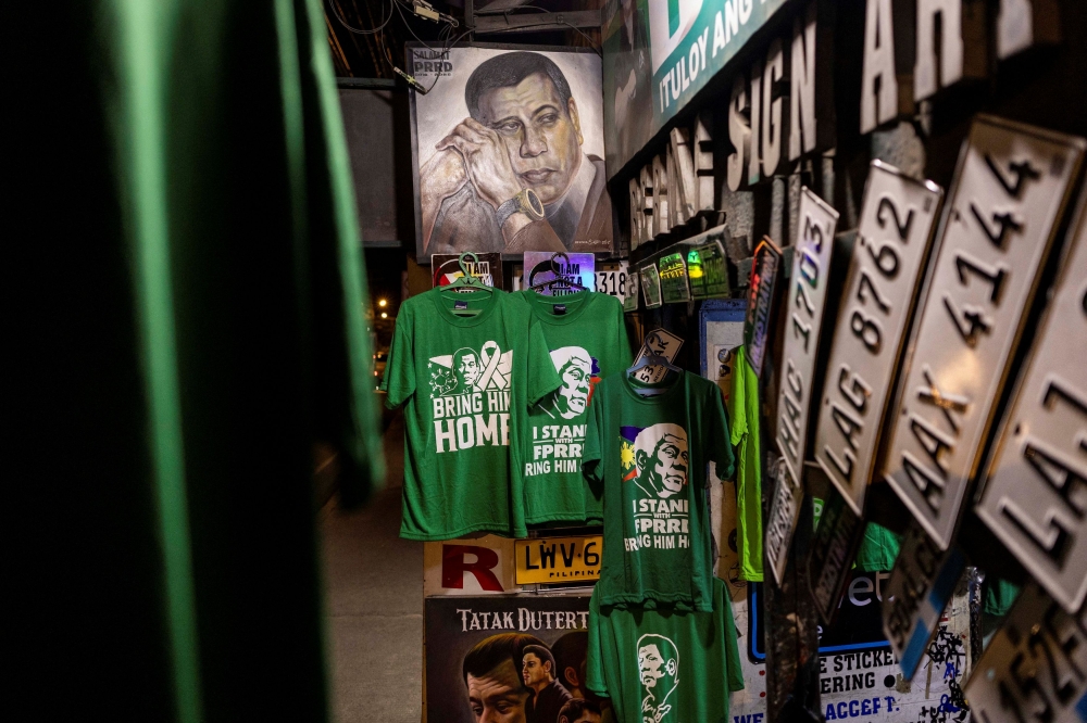 T-shirts with illustrations of former Philippine President Rodrigo Duterte are displayed for sale at a shop in Davao City, Philippines March 29, 2025. — Reuters pic  