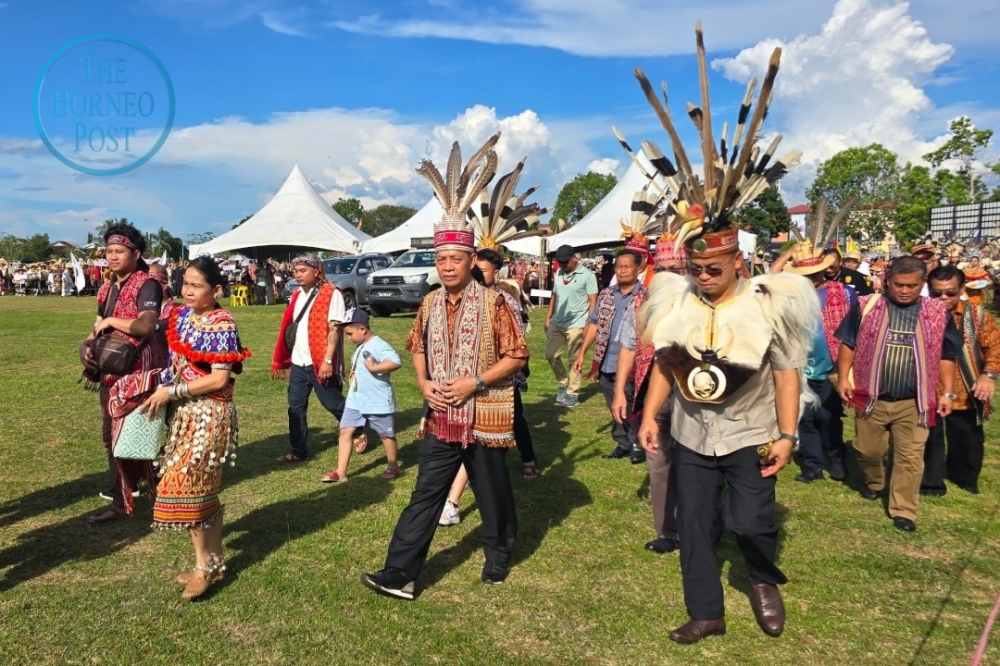 Penguang (2nd right) leads the ‘Niti Daun’ parade, marking his role as Tuai Gawai in this year’s vibrant Gawai Dayak celebrations. — The Borneo Post pic